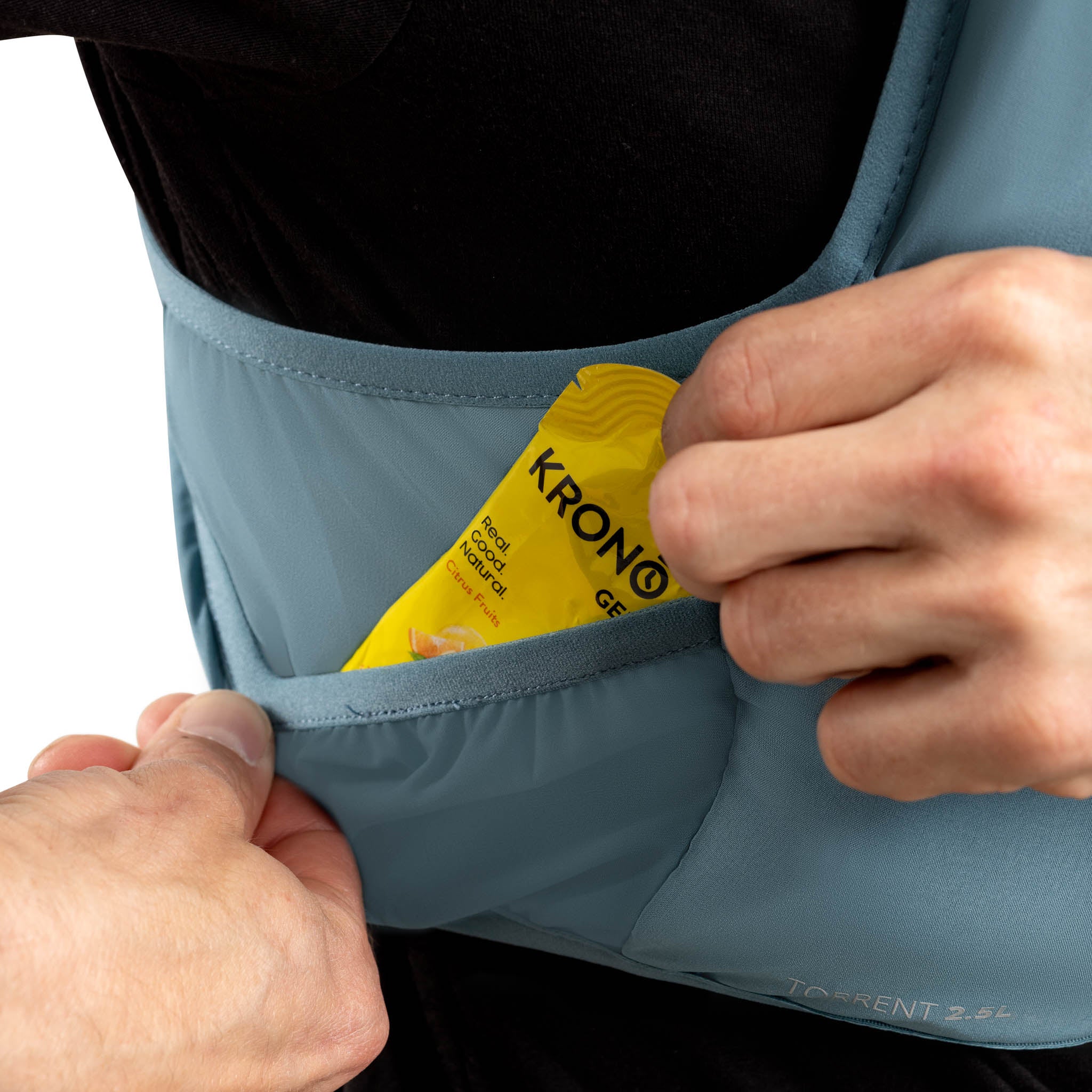Person opening a blue bag with a yellow 'Krono' package inside. #color_steel-blue