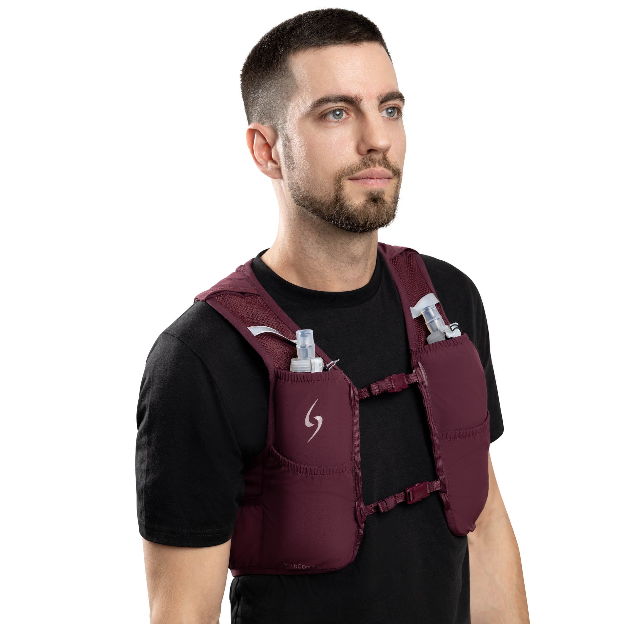 Man wearing a maroon hydration vest on a white background