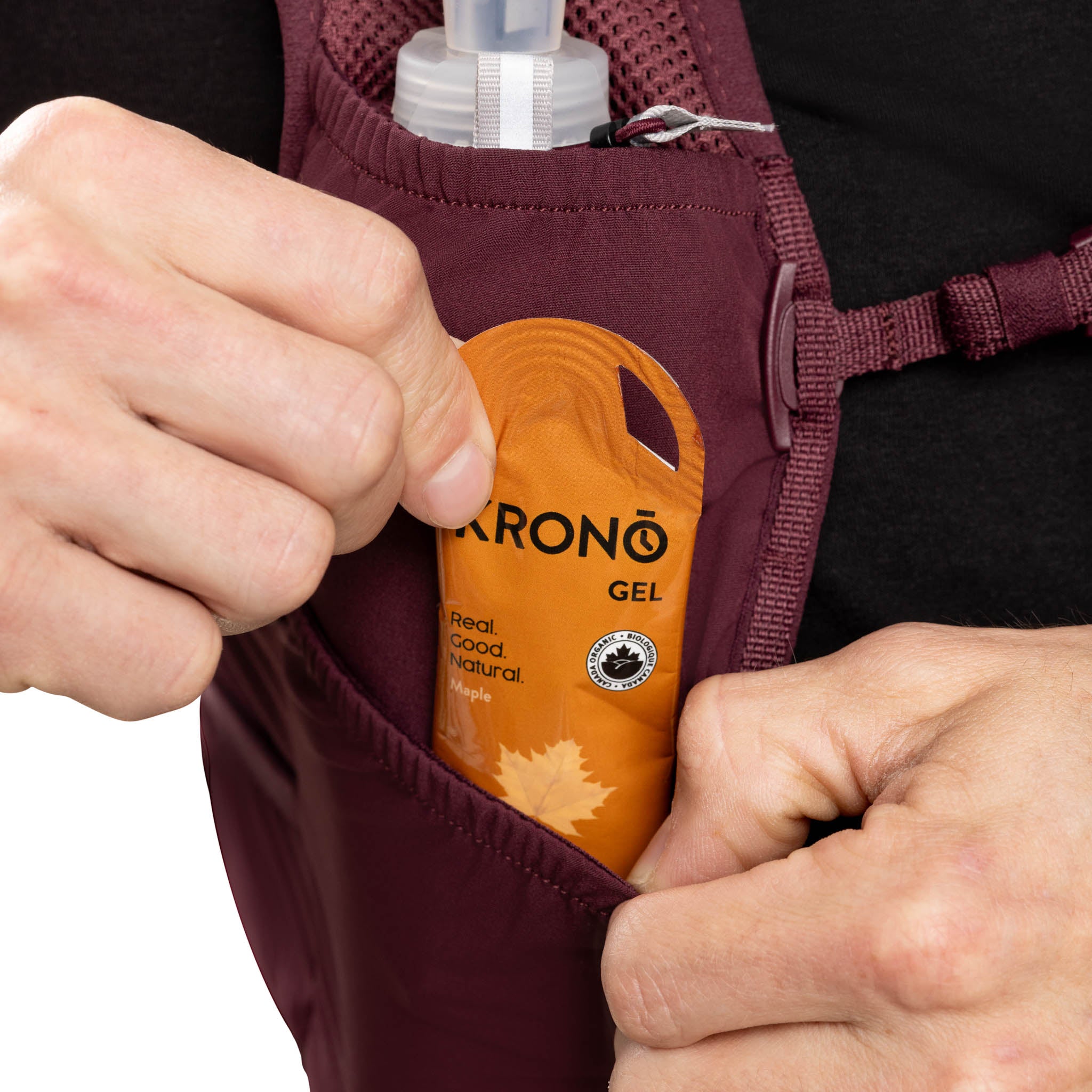 Person retrieving a Krono gel from a pouch on their backpack
