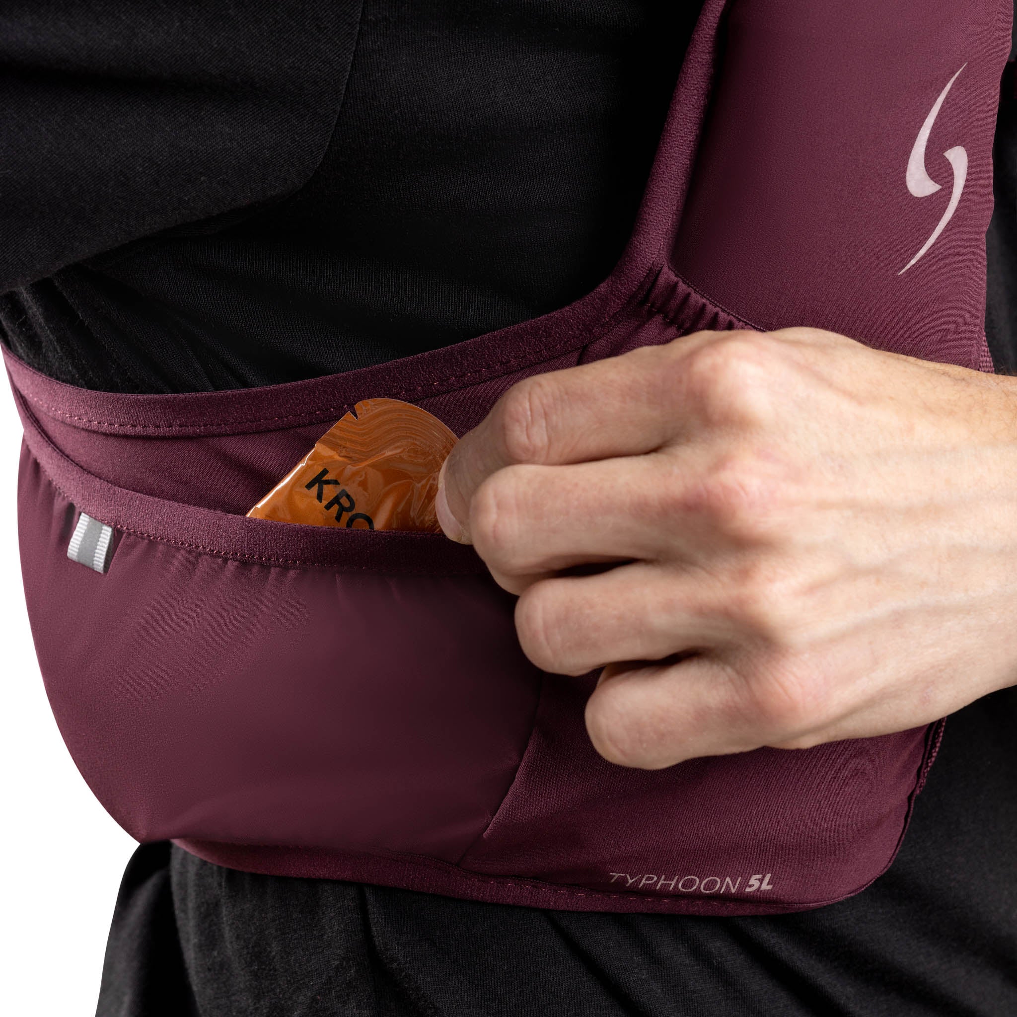 Person wearing a maroon running belt with a small pouch, holding a phone case.