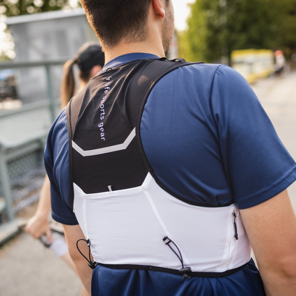 Life sports gear black white Hurricane Running Vest ECO men wear back pocket view 