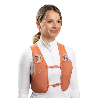 Woman wearing an orange safety vest on a white background #color_terra-cota