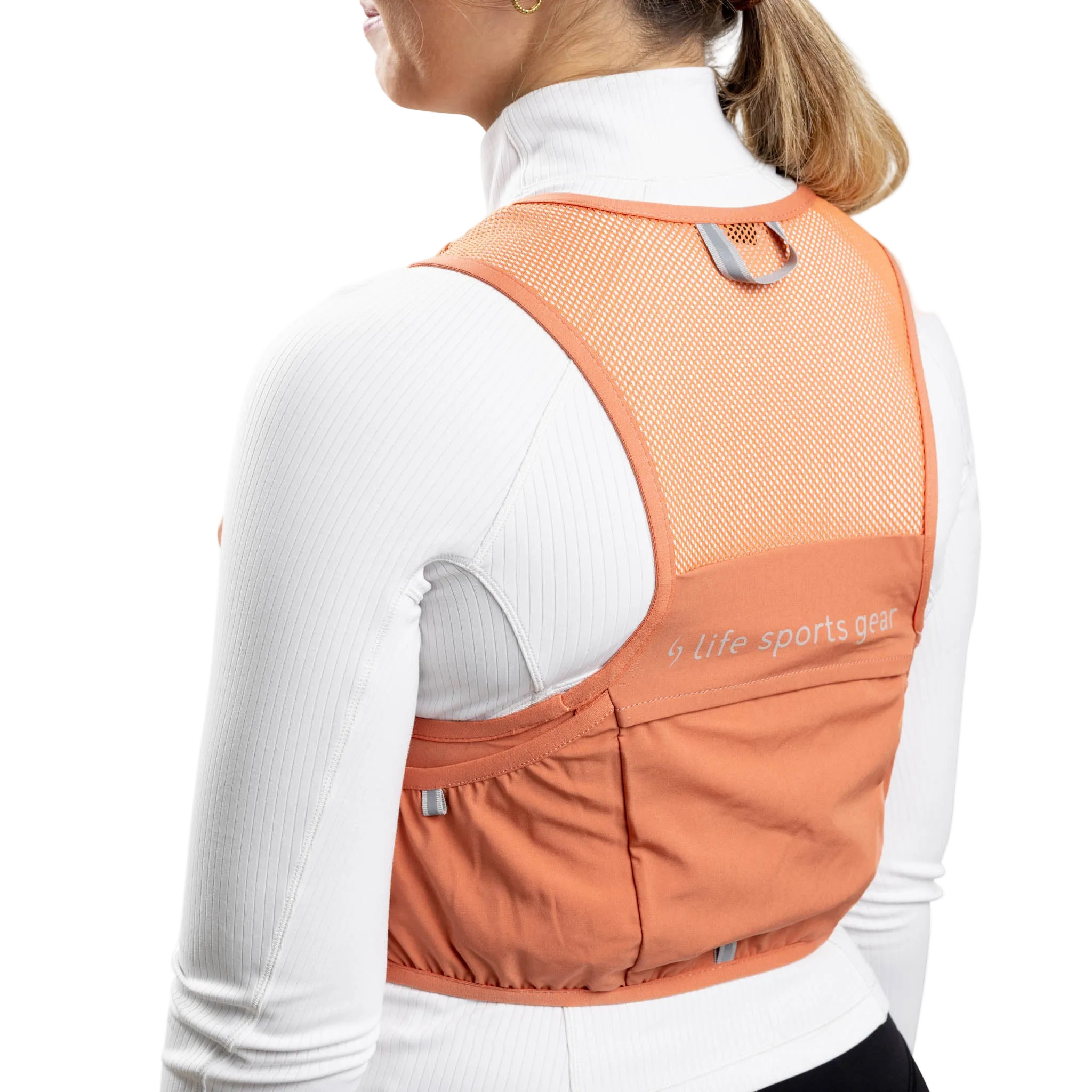 Person wearing an orange sports vest with a visible brand logo on a white background #color_terra-cota